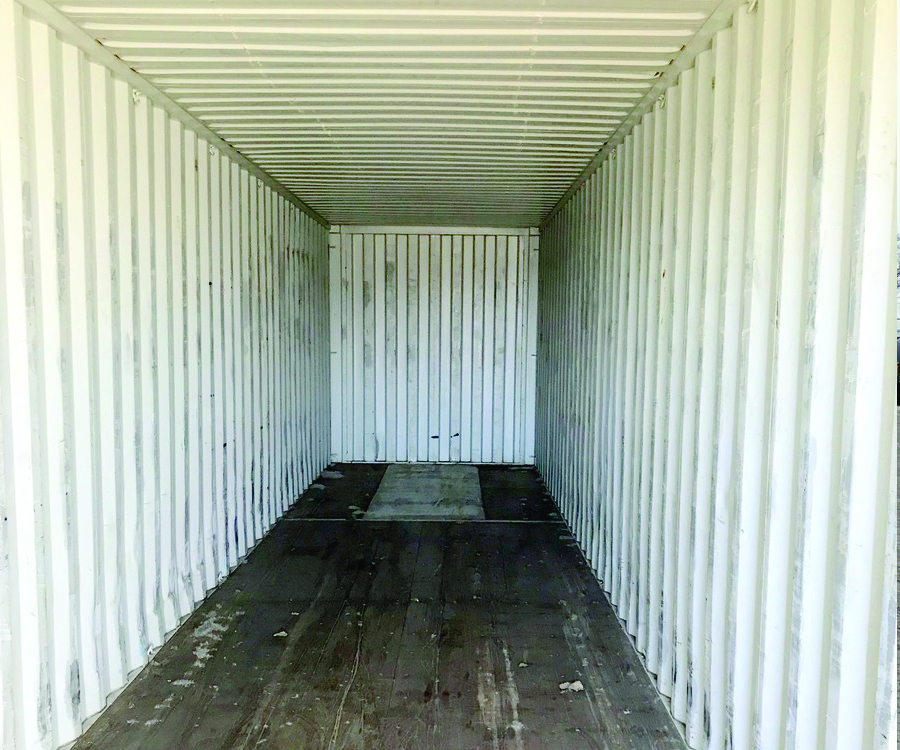 The inside of a white shipping container