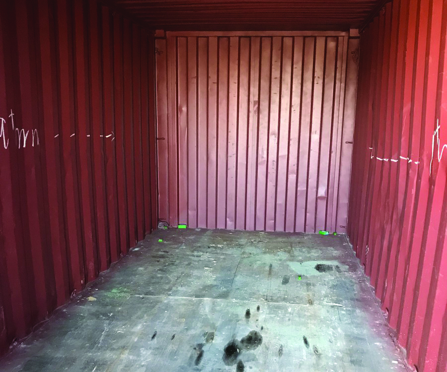 The inside of a red shipping container